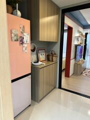 Modern kitchen area with appliances and decor