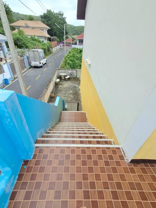 Outdoor staircase leading down to a road