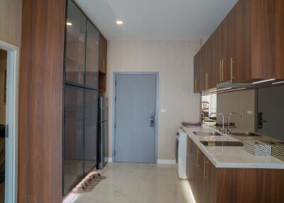 Modern kitchen with wooden cabinetry and appliances