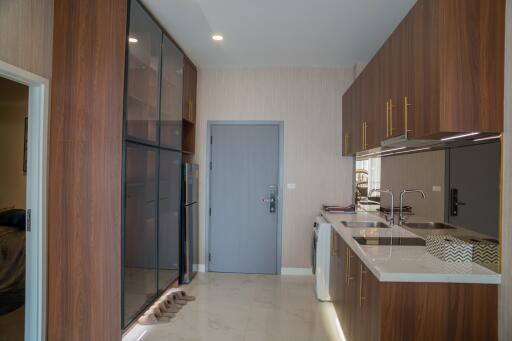 Modern kitchen with wooden cabinetry and appliances