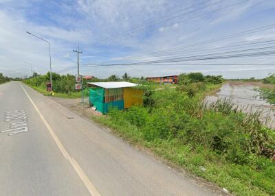 Outdoor roadside view with a small makeshift shelter