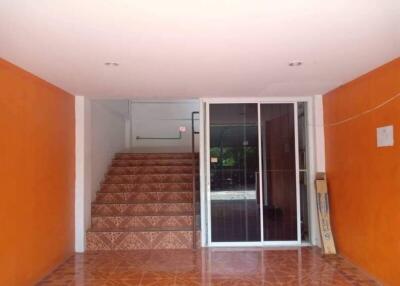 Entryway with stairs and sliding glass door