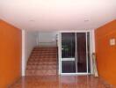 Entryway with stairs and sliding glass door