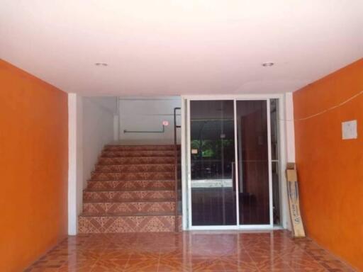 Entryway with stairs and sliding glass door