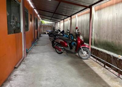 Covered parking area with motorbikes