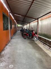 Covered parking area with motorbikes