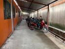 Covered parking area with motorbikes