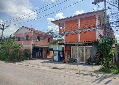 Street view of residential and commercial buildings