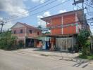 Street view of residential and commercial buildings