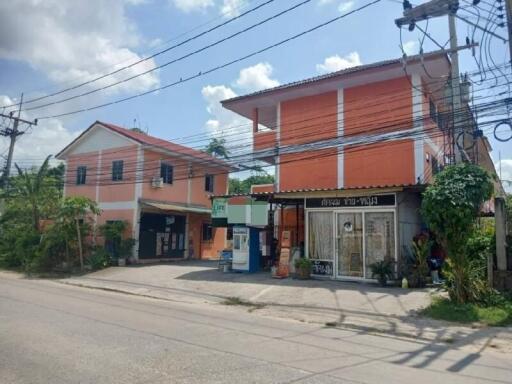 Street view of residential and commercial buildings