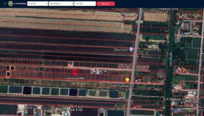 Aerial view of property layout showing plots and surrounding area