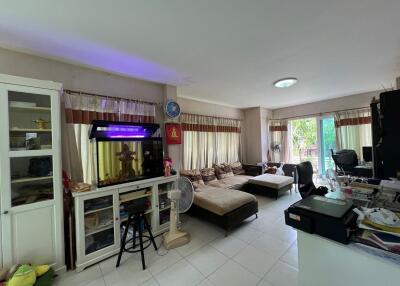 Spacious living room with large sofa and fish tank