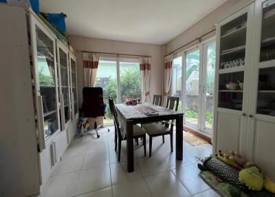 Dining room with large windows and abundant natural light.