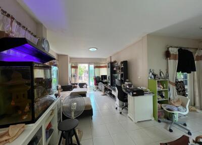 Living room with a mix of furnishings and electronic devices