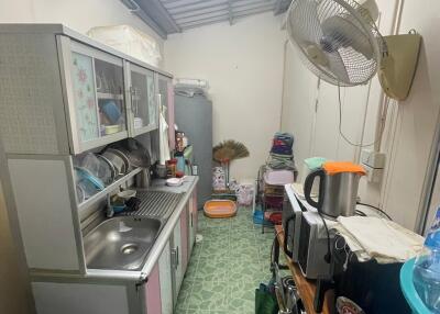 Compact kitchen with appliances and storage