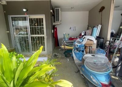 Outdoor area with garage and motorcycle