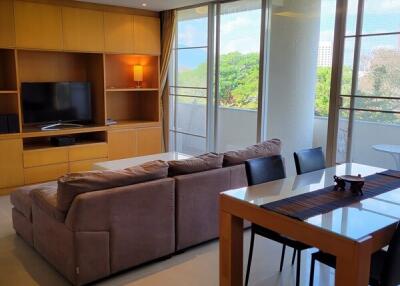 Modern living room with large windows and outdoor view