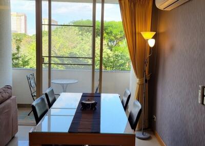 Modern dining room with table, chairs, and a view