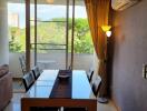 Modern dining room with table, chairs, and a view