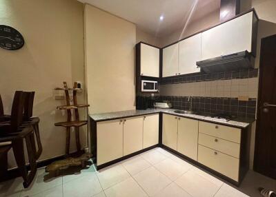 Modern kitchen with countertop and wooden fixtures