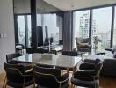 Modern living room with dining area and city view