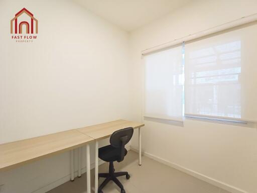 Home office with desk, chair, and window