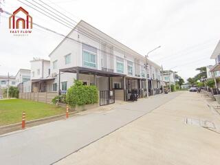 Front view of a residential building complex with attached houses