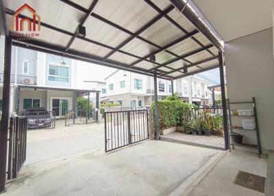 Covered carport area with gated entrance