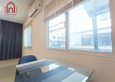 Modern dining space with air conditioning and large windows