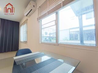 Modern dining space with air conditioning and large windows