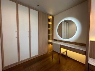 Modern bedroom with built-in wardrobe and vanity