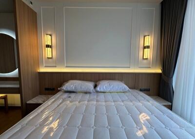 Modern bedroom with bed and lighting