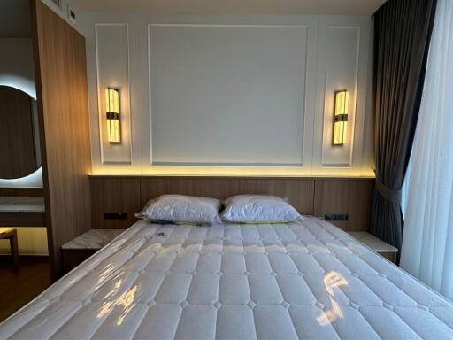 Modern bedroom with bed and lighting