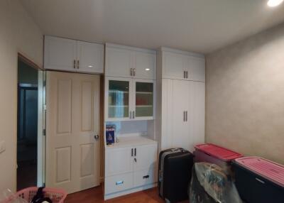 Storage room with white cabinets