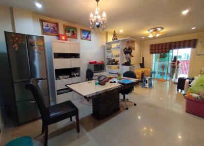 Spacious living room with modern furnishings and dining area