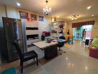 Spacious living room with modern furnishings and dining area