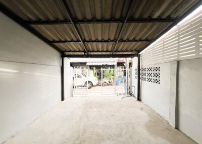 Spacious garage with open door and ample lighting