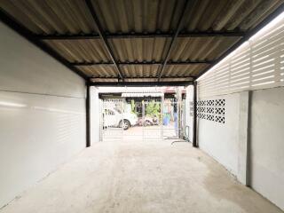 Spacious garage with open door and ample lighting