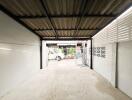 Spacious garage with open door and ample lighting