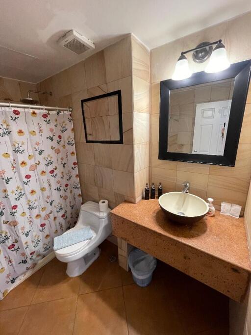 Bathroom with vanity and shower