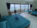 Modern bedroom with large window and ocean view