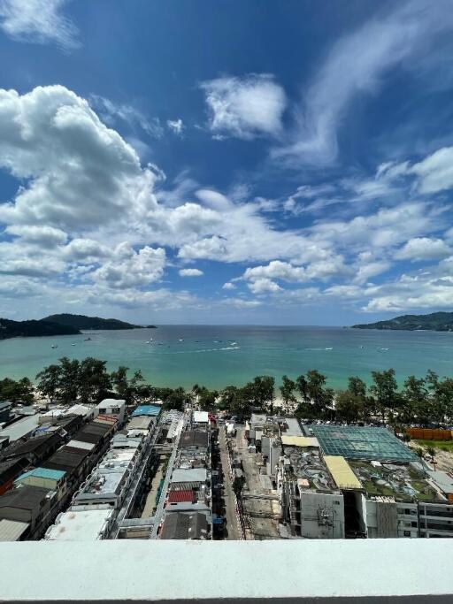 Aerial view of a coastal town with a clear sky and ocean