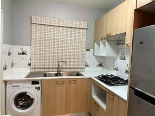 Modern kitchen with wooden cabinets and appliances