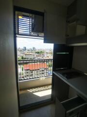 Small kitchen with balcony view