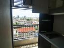 Small kitchen with balcony view