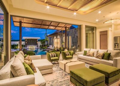 Spacious living room with view of outdoor pool area