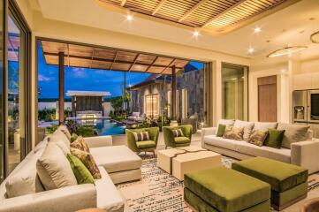 Spacious living room with view of outdoor pool area