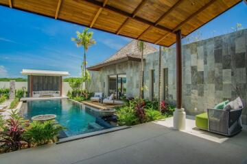 Outdoor patio area with pool and seating