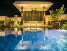 Modern poolside lounge area with canopy at night