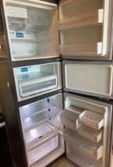 Open refrigerator with multiple compartments